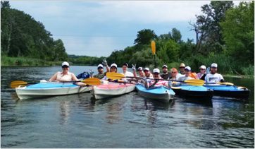 photo showing vana team mates on fun canoeing event